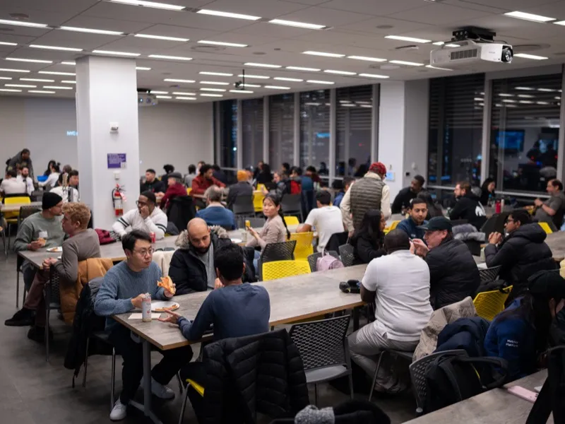 Attendees listening to the presentation